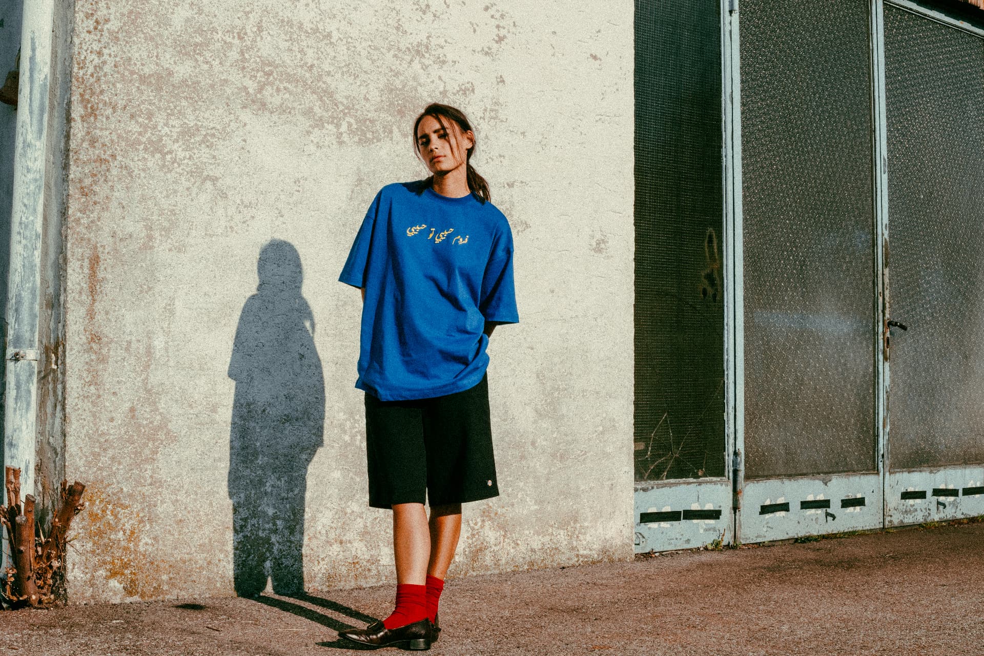 From Habibi to Habibi fashion photograph 12 — against a weathered wall
