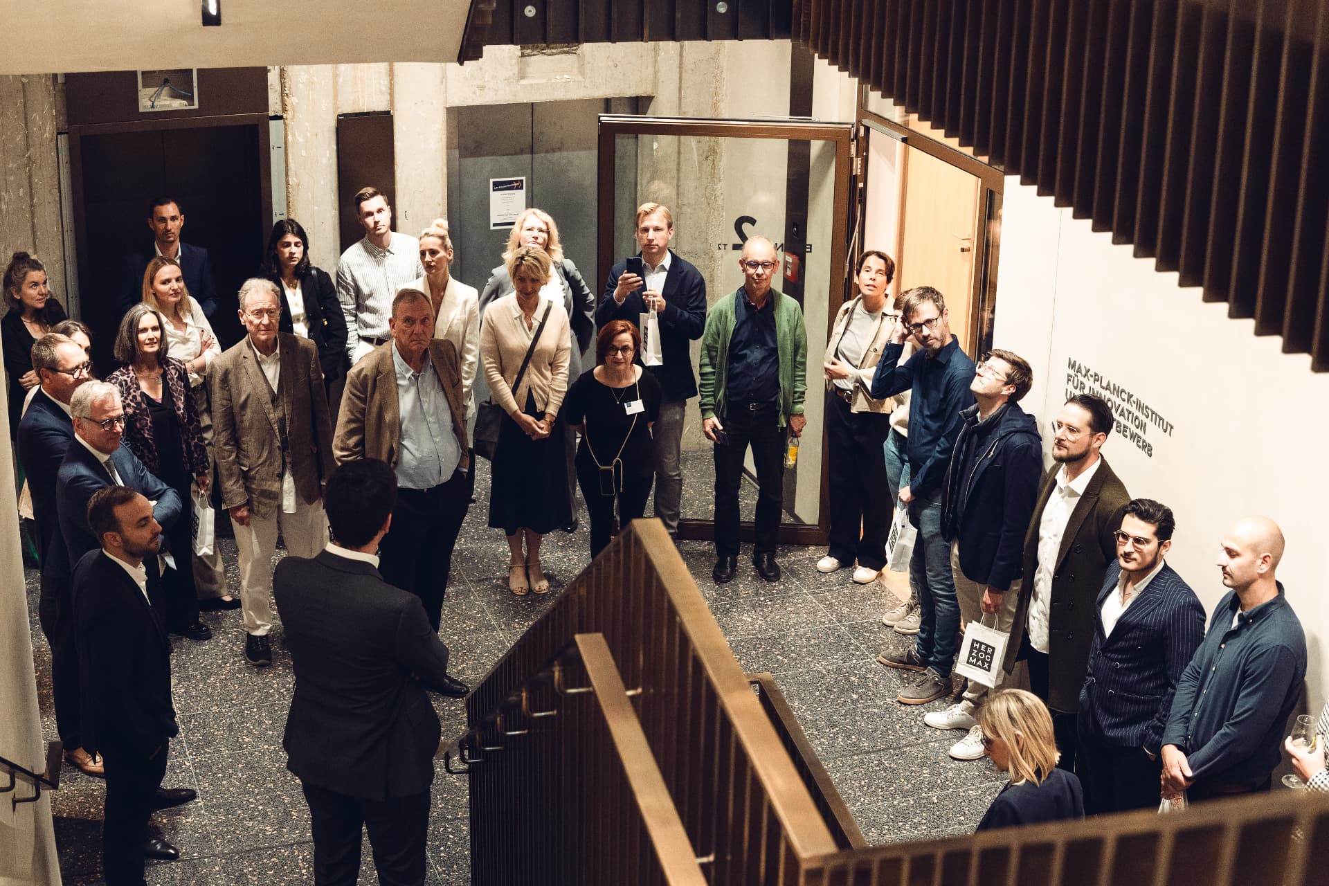 Guests gathered on the staircase during the opening tour through Herzog Max