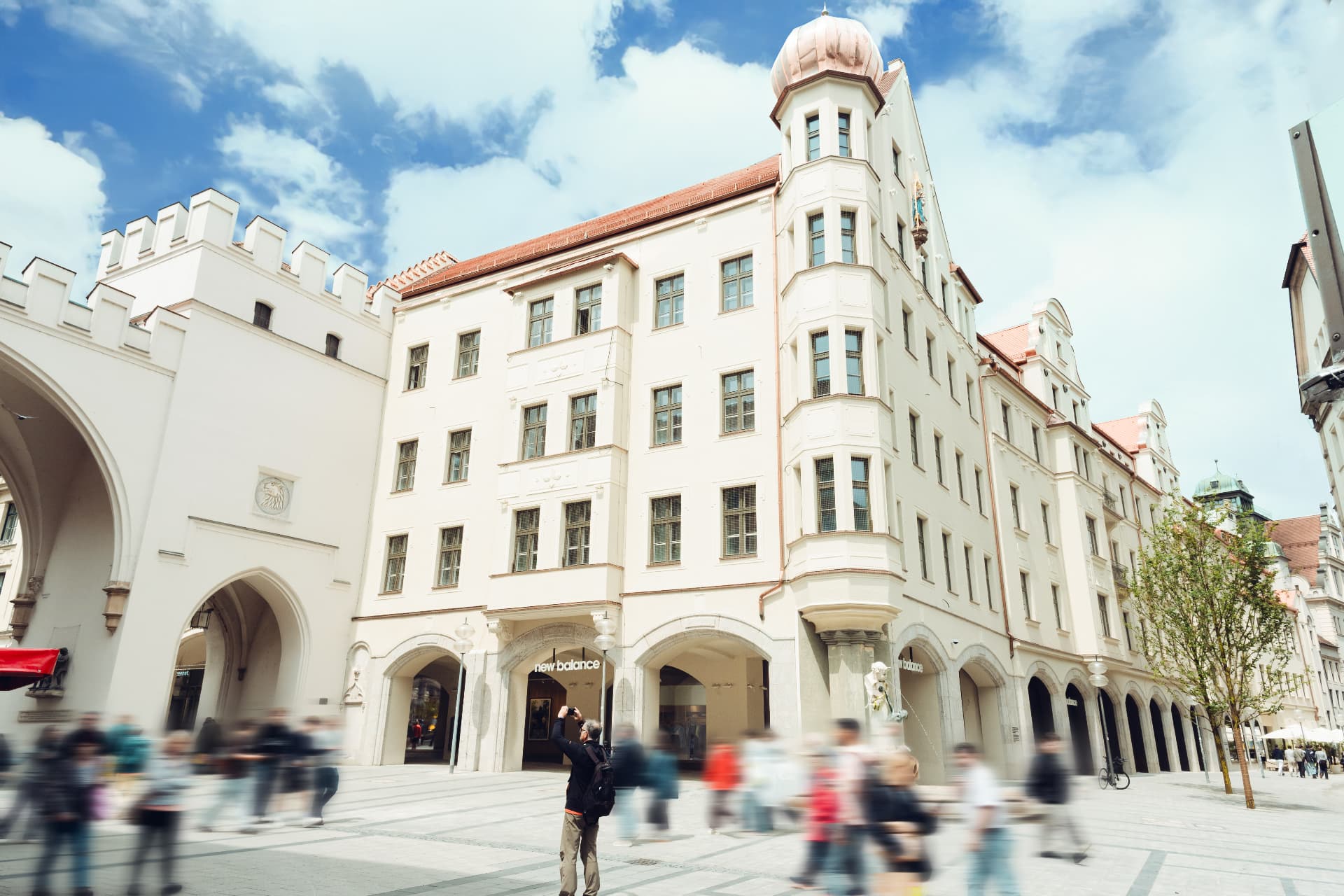 Herzog Max street view — the restored corner building with its copper dome at Karlstor, Munich