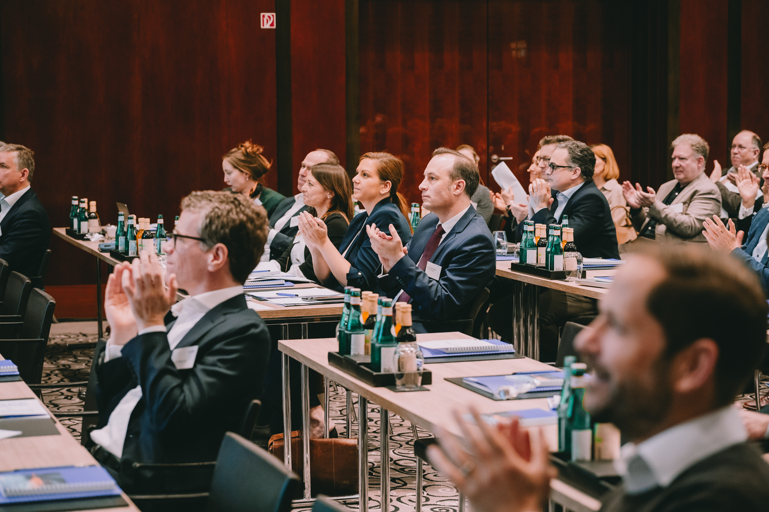 NOERR Competition Day audience applauding at tables in the conference room